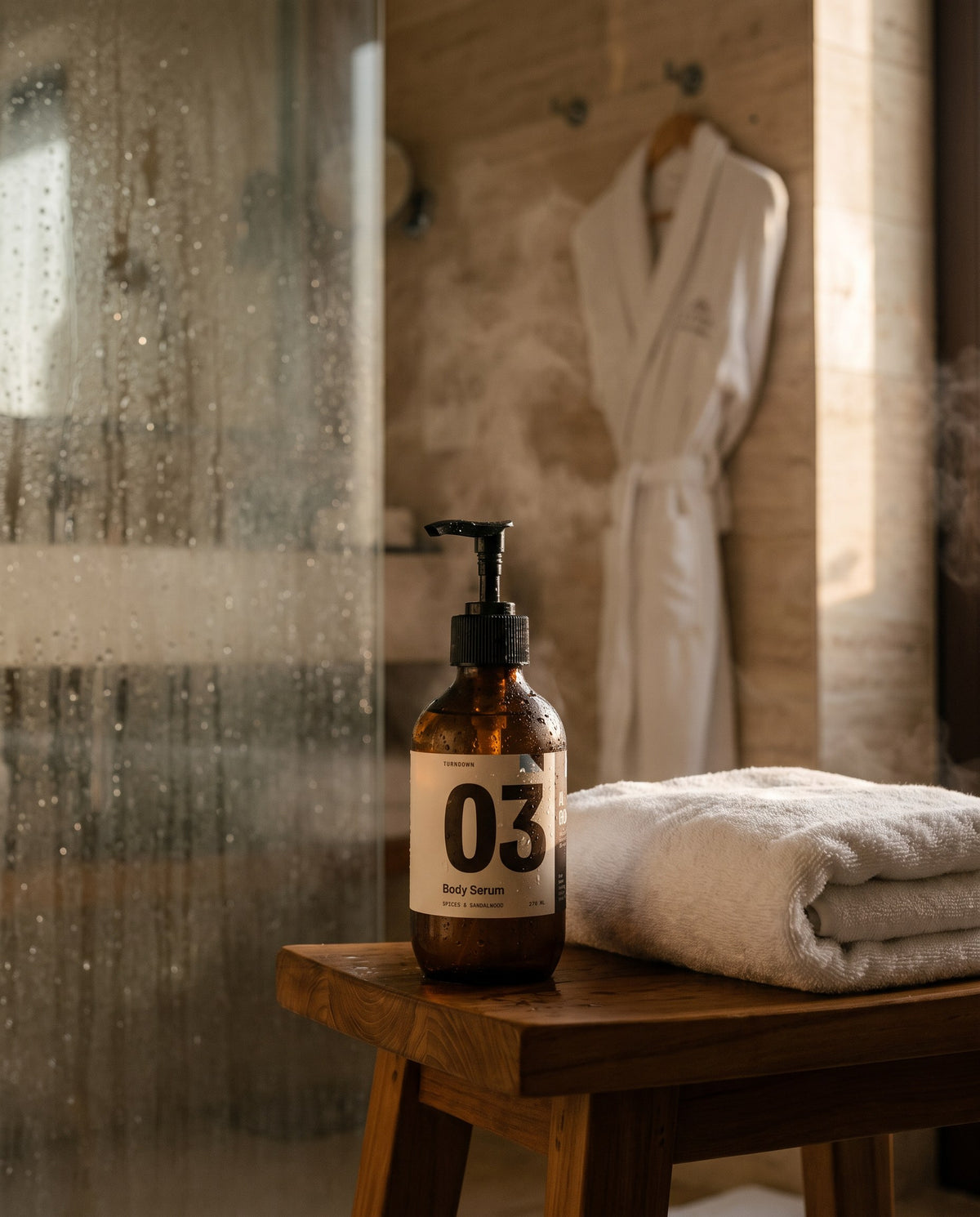 No. 03 on a teak stool next to a steamy hotel shower