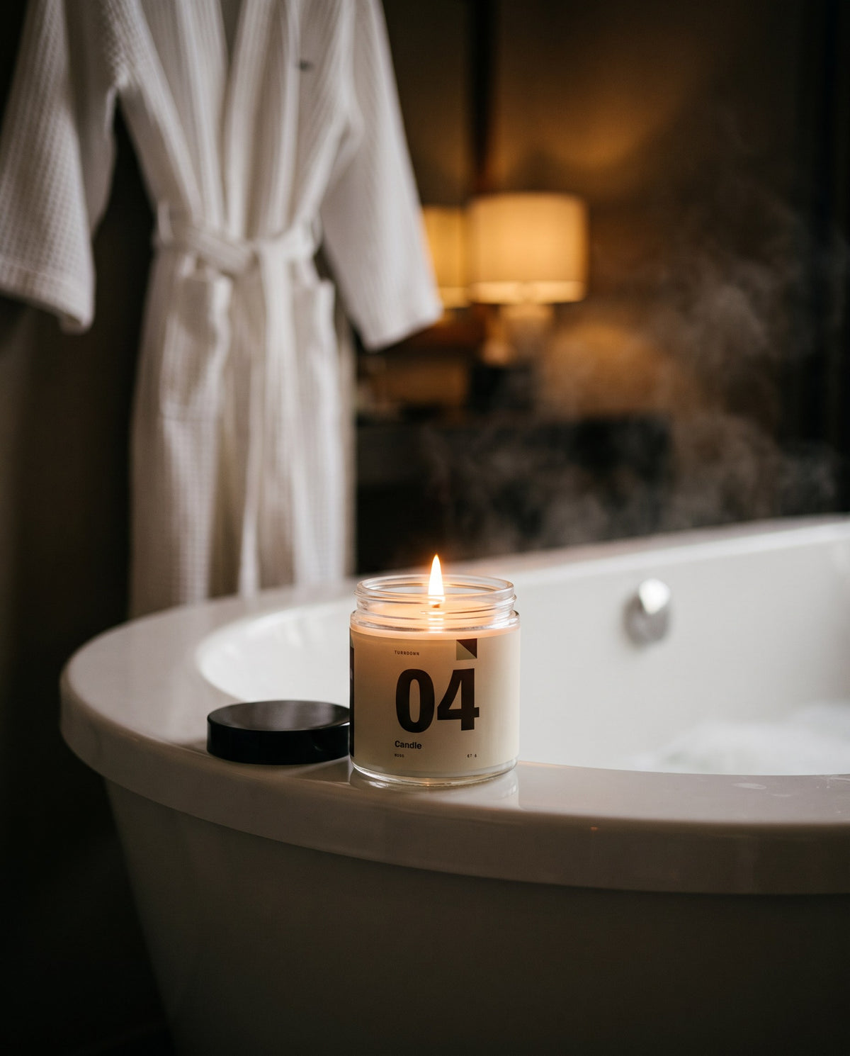 No. 04 burning on the rim of a hotel bathtub in the evening