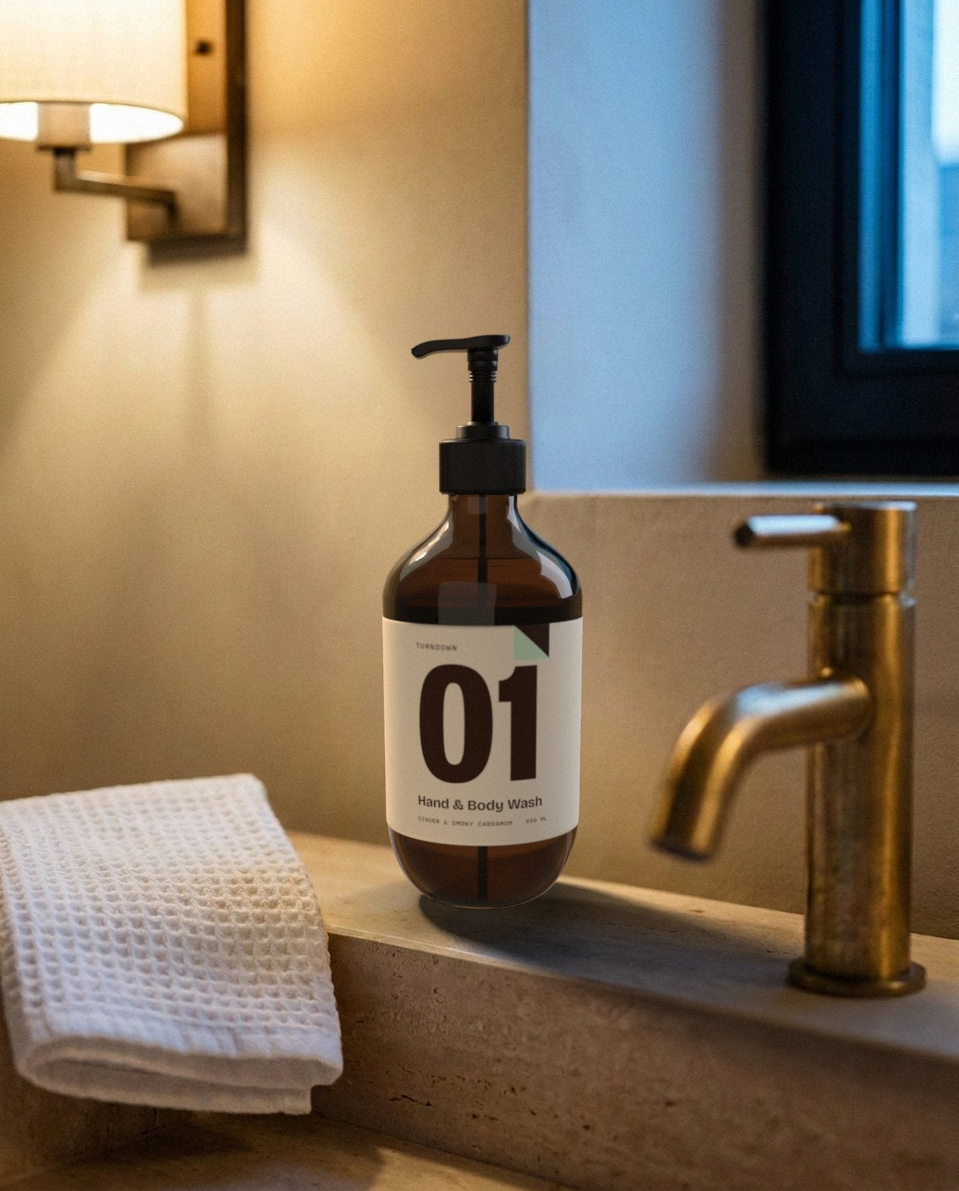 No. 01 on a stone hotel sink next to a brass tap